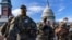 FILE - National Guard troops reinforce security around the U.S. Capitol in Washington, Jan. 17, 2021.