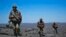 French soldiers patrol in the Terz valley, south of the town of Tessalit in northern Mali, Mar. 20, 2013.