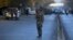 A policeman stands guard at the site of a suicide attack in central Kabul, Afghanistan, Oct. 31, 2017. 