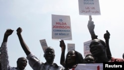 South Sudanese hold banners during a rally in support of President Salva Kiir's administration in Juba, March 10, 2014. 