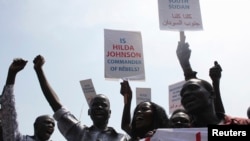 South Sudanese hold banners during a rally in support of President Salva Kiir's administration in Juba, March 10, 2014.