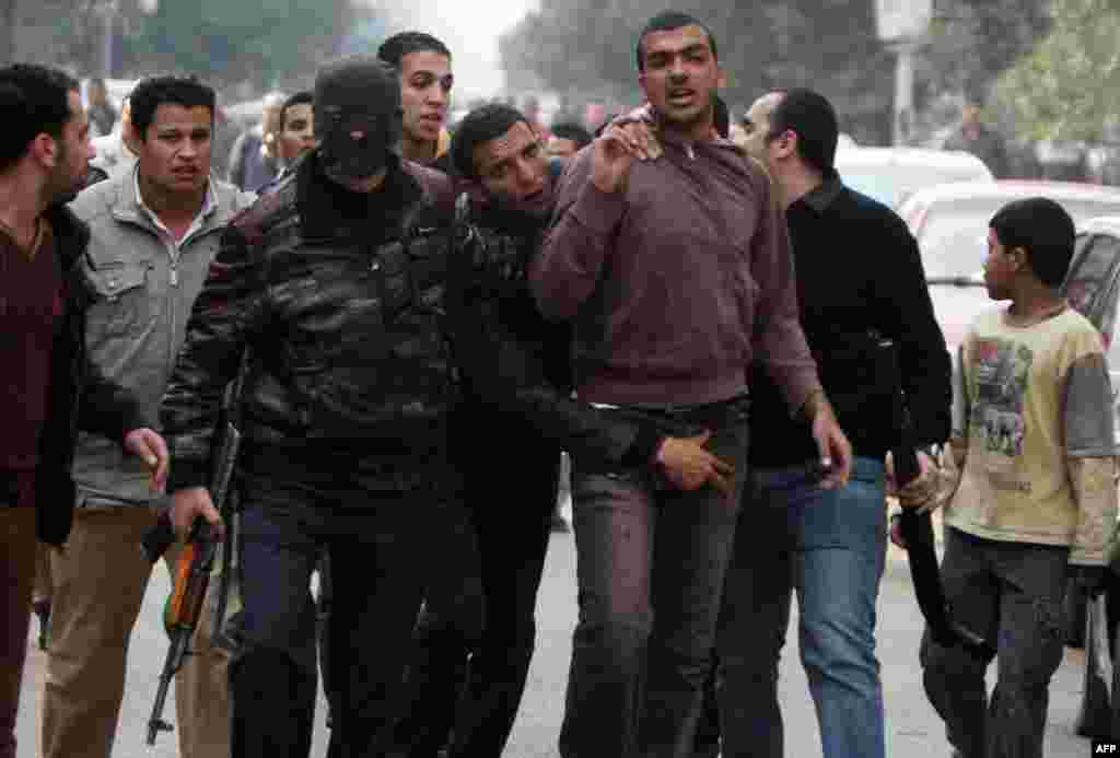 Egyptian police arrest a Muslim Brotherhood supporter (C-R) following a demonstration in the Nasr City district of Cairo.