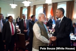 President Barack Obama and Prime Minister Narendra Modi of India talk after a working lunch in the Cabinet Room of the White House, June 7, 2016.