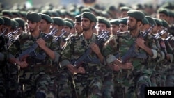 FILE - Members of Iran's Revolutionary Guards march during a military parade to commemorate the 1980-88 Iran-Iraq war in Tehran Sept. 22, 2007.