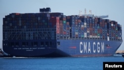 FILE - Containers are pictured on the Antoine de Saint Exupery, a cargo ship of French shipping company CMA CGM after leaving the port of Algeciras, Spain, May 31, 2018. CMA CGM said July 7, 2018, that it was pulling out of Iran for fear of becoming entangled in U.S. sanctions.