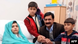 A handout picture received from the Queen Elizabeth Hospital/University Hospitals in Birmingham shows Pakistani schoolgirl Malala Yousafzai, and her family.