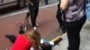 This photo posted to an Instagram account belonging to a person identified as mr_mookie shows a victim being tended to by pedestrians outside the Empire State Building, Aug. 24, 2012. (AP Photo/mr_mookie via Instagram)