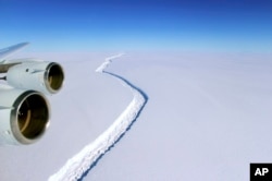 FILE - This Nov. 10, 2016 aerial photo released by NASA, shows a rift in the Antarctic Peninsula's Larsen C ice shelf. According to NASA, IceBridge scientists measured the Larsen C fracture to be about 70 miles long, more than 300 feet wide