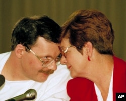 FILE - Former U.S. hostage Terry Anderson, left, and his sister Peggy Say are shown during a news conference in Wiesbaden, Germany, two days after Anderson was released after nearly seven years in captivity in Beirut, Dec. 6, 1991.
