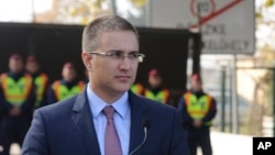 FILE - Serbian Interior Minister Nebojsa Stefanovic shown at the Roszke-Horgos border crossing between Hungary and Serbia in Roszke, Hungary, Oct. 22, 2015. He announced an anti-corruption roundup, Dec. 26, 2015.