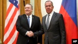 U.S. Secretary of State Mike Pompeo, left, and Russian Foreign Minister Sergey Lavrov pose for a photo prior to their talks in the Black Sea resort city of Sochi, southern Russia, May 14, 2019.