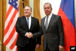 U.S. Secretary of State Mike Pompeo, left, and Russian Foreign Minister Sergey Lavrov pose for a photo prior to their talks in the Black Sea resort city of Sochi, southern Russia, May 14, 2019.