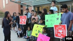 FILE - Edith Galvan, an undocumented immigrant, leads a vigil in Raleigh, North Carolina. Galvan was brought to the U.S. as a child, and she is one of the 750,000 approved for deportation relief under the DACA program. (A. Barros / VOA) 