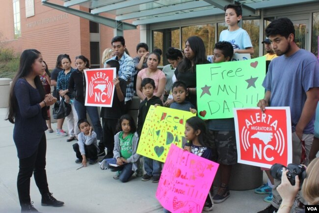 Edith Galvan, an undocumented immigrant, leads a vigil in Raleigh, North Carolina. Galvan was brought to the U.S. as a child, and she is one of the 750,000 approved for deportation relief under the DACA program. (Photo: A. Barros / VOA)