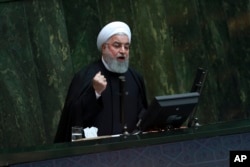 Iranian President Hassan Rouhani speaks as he submits next year's budget bill to parliament in Tehran, Iran, Dec. 25, 2018.