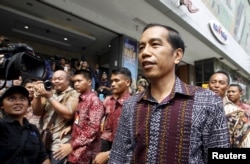 FILE - Indonesia's President Joko Widodo visits a department store located near Thursday's gun and bomb attack in central Jakarta, Jan. 15, 2016.