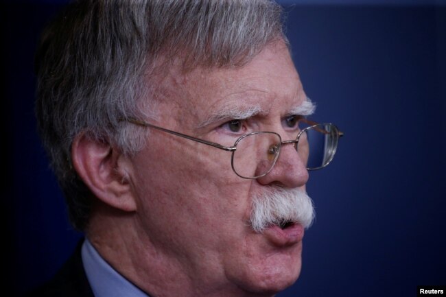 FILE - U.S. national security adviser John Bolton answers questions from reporters after announcing that the U.S. will withdraw from the Vienna protocol and the 1955 "Treaty of Amity" with Iran, during a news conference in the White House briefing room in Washington, Oct. 3, 2018.