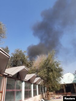 Smoke billows near the Sardar Mohammad Daud Khan National Military Hospital after an explosion in central Kabul, Afghanistan Nov. 2, 2021.