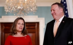 Canadian Minister of Foreign Affairs, Chrystia Freeland speaks with Secretary of State Mike Pompeo, before their meeting at the State Department, May 11, 2018 in Washington.