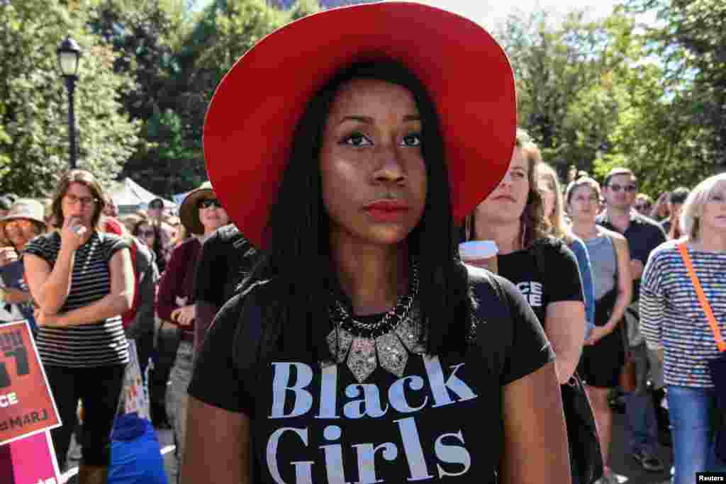 A woman wearing a shirt that says "Black Girls" participates in a protest called March for Racial Justice in New York City.