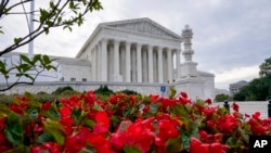 In this Oct. 4, 2021 photo, the Supreme Court is seen on the first day of the new term, in Washington.