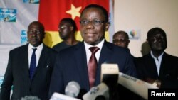 FILE - Maurice Kamto, a presidential candidate of Renaissance Movement (MRC), reacts as he holds a news conference at his headquarter in Yaounde, Cameroon, Oct. 8, 2018. 
