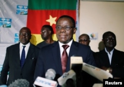 Maurice Kamto, a presidential candidate of Renaissance Movement (MRC), reacts as he holds a news conference at his headquarter in Yaounde, Cameroon, Oct. 8, 2018.