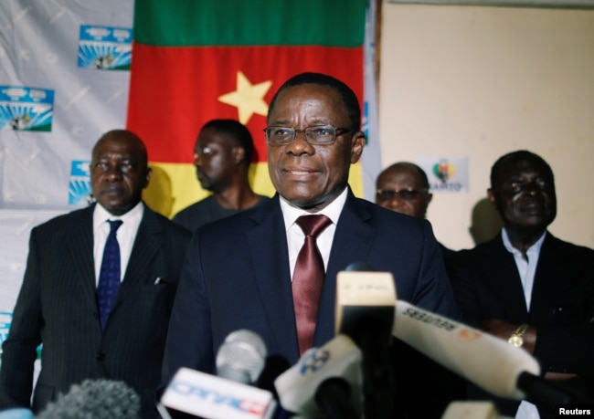 FILE - Maurice Kamto, a presidential candidate of Renaissance Movement (MRC), reacts as he holds a news conference at his headquarter in Yaounde, Cameroon, Oct. 8, 2018.