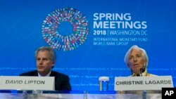 International Monetary Fund (IMF) Managing Director Christine Lagarde accompanied by First Deputy Managing Director, David Lipton, speaks during a news conference at the World Bank/IMF Spring Meetings, in Washington, April 19, 2018. 