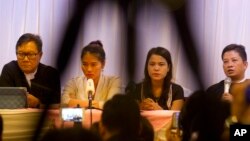 Than Zaw Aung (R), a lawyer of two Reuters journalists, holds a press briefing with Pan Ei Mon (2nd-L), wife of Reuters journalist Wa Lone, Chit Su Win (2nd-R), wife of Reuters journalist Kyaw Soe Oo, and Khin Maung Zaw (L), a lawyer of two Reuters journalists, at a hotel in Yangon, Myanmar on Sept. 4, 2018. 