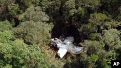 Handout picture released by an Indonesian Rescue Team on the wreckage of a Casa 212 turboprop plane lies in among the trees at mount Hulusekelem in Bahorok, North Sumatra, September 30, 2011.