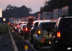 Traffic backs in the northbound lanes of Interstate 75 near the Georgia-Florida state line as people flee Hurricane Irma, Sept. 8, 2017, in Jennings, Fla.