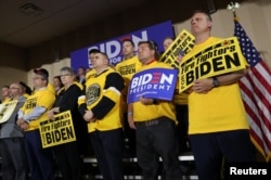 Union supporters stand behind U.S. Democratic presidential candidate and former Vice President Joe Biden as he addresses workers at the Teamsters Local 249 hall during his first public event since announcing his bid for the 2020 Democratic presidential nomination in Pittsburgh, Pennsylvania, April 29, 2019.