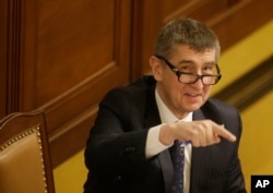 FILE - In this March 23, 2016 image, Czech Republic's Finance Minister Andrej Babis gestures prior to a session of Parliament's lower house in Prague, Czech Republic.