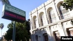A sign at Hamilton High School is pictured reading "School Closed" in Los Angeles, Calif. Dec. 15, 2015. 