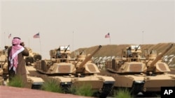US Army heavy battle tanks are seen during the military parade commemorating the 20th anniversary of the liberation of Kuwait from the 1990 Iraqi invasion in Subiya, Kuwait, February 26, 2011