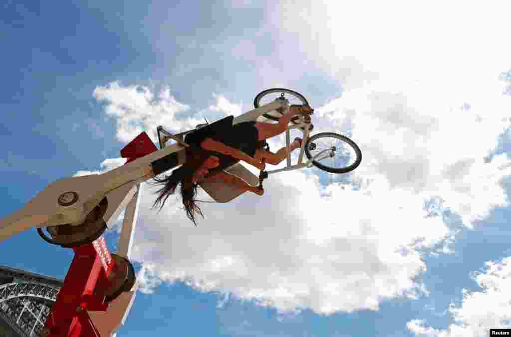 A cyclist rides the &quot;Space Bikes&quot; attraction on the eve of World Bicycle Day in Brussels, Belgium.