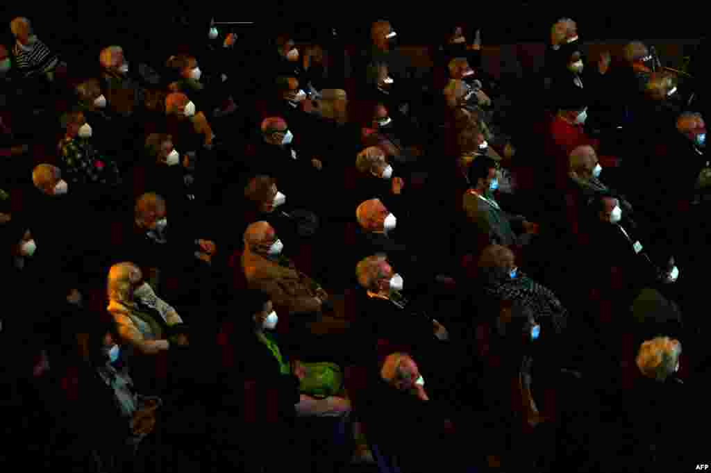 People living in nursery homes for the elderly who have already received a Covid-19 vaccine attend a performance at the EDP Gran Via Theatre in Madrid, Spain.