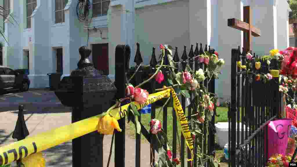 Police tape and flowers outside Emanuel AME Church, Charleston, June 20, 2015. (Amanda Scott/VOA)