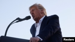 FILE PHOTO: Former U.S. President Donald Trump holds a campaign rally in Waco, Texas