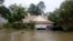 Floodwaters from tropical storm Harvey partially submerge houses and cars in east Houston, Texas, Aug. 28, 2017. 
