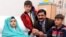 A handout picture received from the Queen Elizabeth Hospital/University Hospitals in Birmingham on October 26, 2012, shows Pakistani schoolgirl Malala Yousafzai, and her family.
