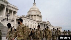 Members of the National Guard arrive to the U.S. Capitol days after supporters of U.S. President Donald Trump stormed the Capitol in Washington, Jan. 11, 2021.