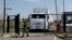 FILE - A Russian border guard opens a gate in Russia's Rostov-on-Don region, bordering Ukraine, Aug. 22, 2014.