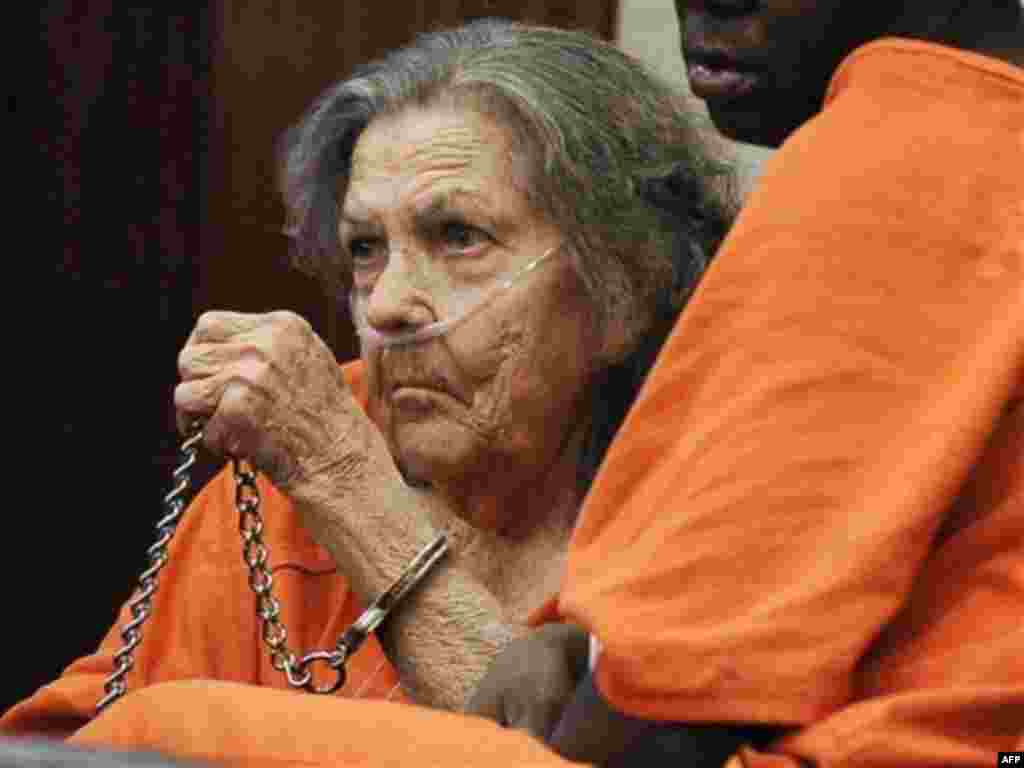 Mary Ann Rivera adjusts her chain as she sits in a Houston courtroom waiting to appear before a judge Friday, Oct. 21, 2011. Rivera, 76, is charged with murder by omission in the 1970 death of her husband. Rivera had been a fugitive since she posted a $10