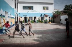 Talibés who were abused by their teachers play soccer at their shelter, Dec. 12, 2019, in Dakar, Senegal. (Annika Hammerschlag/VOA)