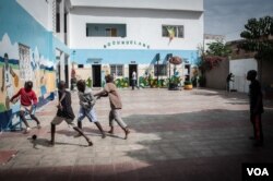 Talibés who were abused by their teachers play soccer at their shelter, Dec. 12, 2019, in Dakar, Senegal. (Annika Hammerschlag/VOA)