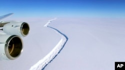 This Nov. 10, 2016 aerial photo released by NASA, shows the growing crack in the Antarctic Peninsula's Larsen C ice shelf. (John Sonntag/NASA via AP)