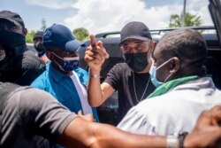 Former Haitian President Michel Martelly arrives at the OFATMA hospital to visit patients and medical personnel in Les Cayes, Haiti, Aug. 20, 2021.