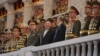 资料照片：官方的朝鲜中央通讯社发布的照片显示朝鲜领导人金正恩在平壤与中共政治局委员李鸿忠和俄罗斯国防部长绍伊古观看朝鲜所称的“胜利日”阅兵式。(2023年7月17日)